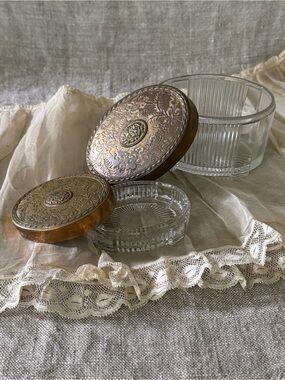 vintage Art Deco glass vanity powder jars with floral brass lids